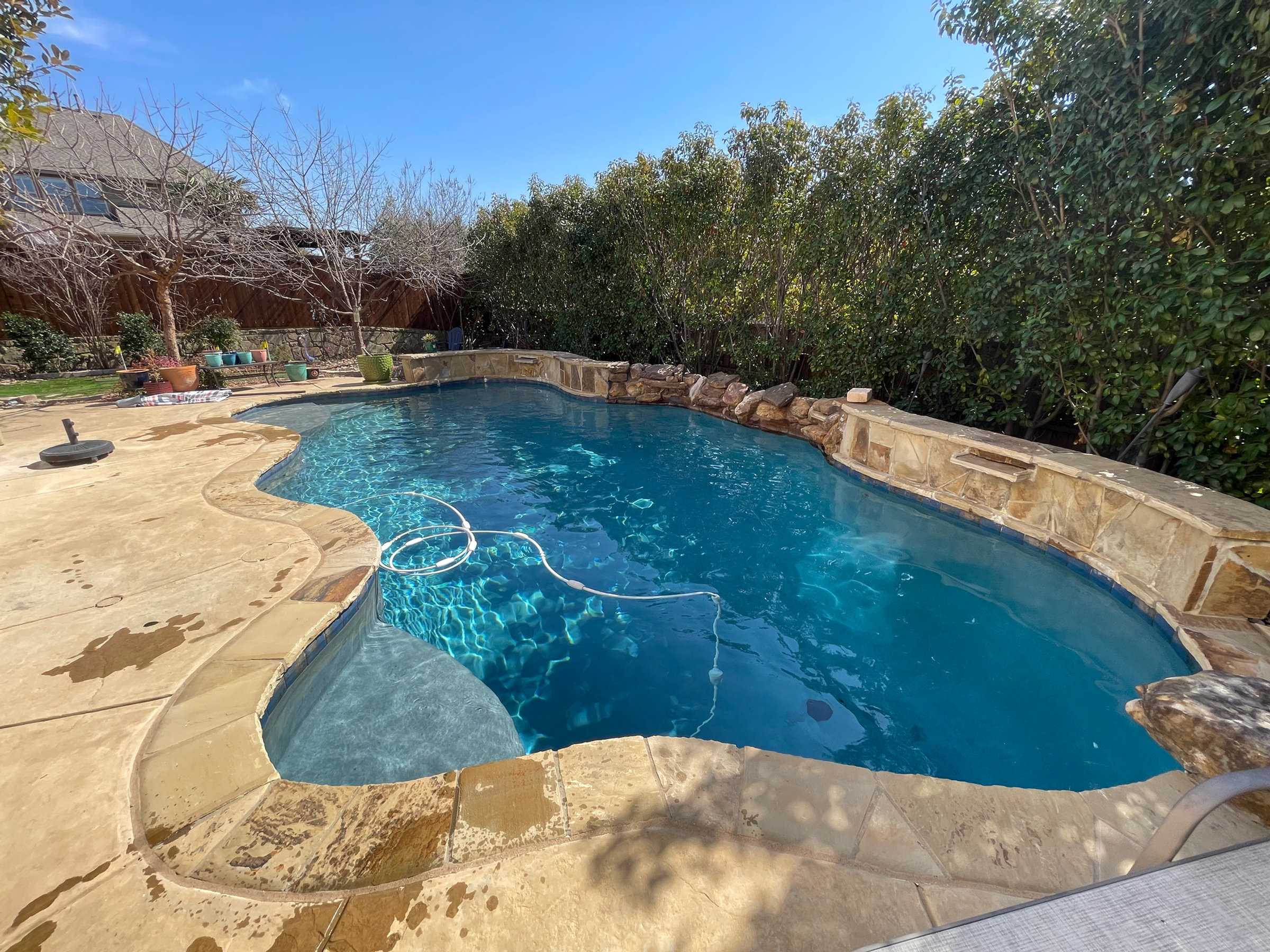 Pool cleaning and chemical balancing in progress