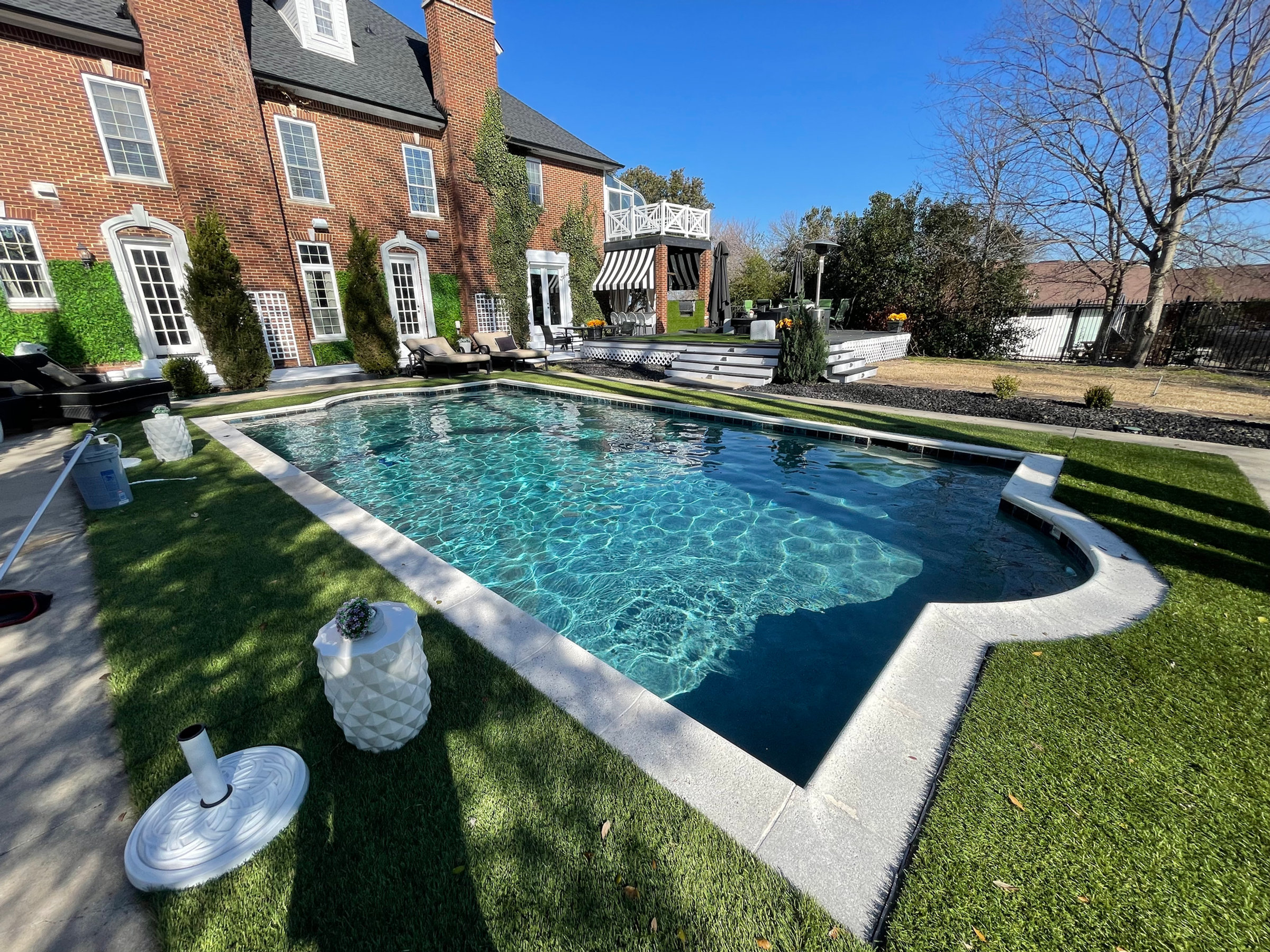 Resort-style backyard pool maintained by Blue Quality Pools