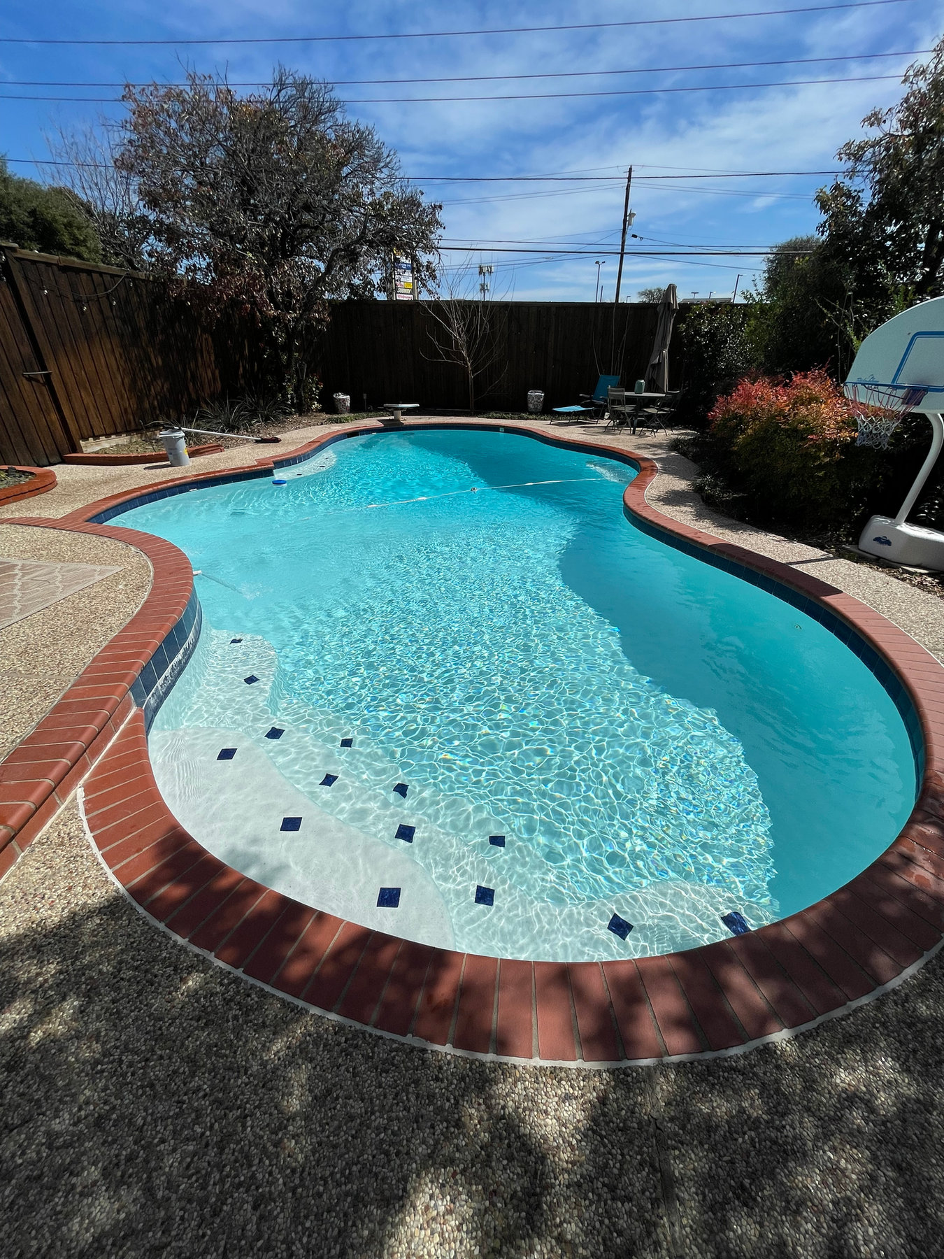 Custom backyard pool with raised spa